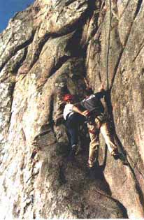 Scout climbing with instructor